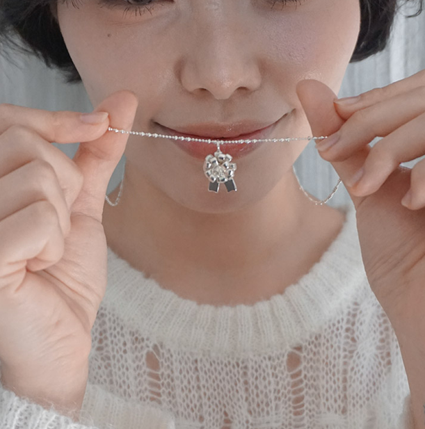 ROSETTE RIBBON PENDENT NECKLACE